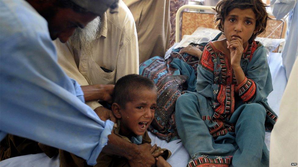 Children treated at a makeshift hospital in Awaran on 25 September 2013