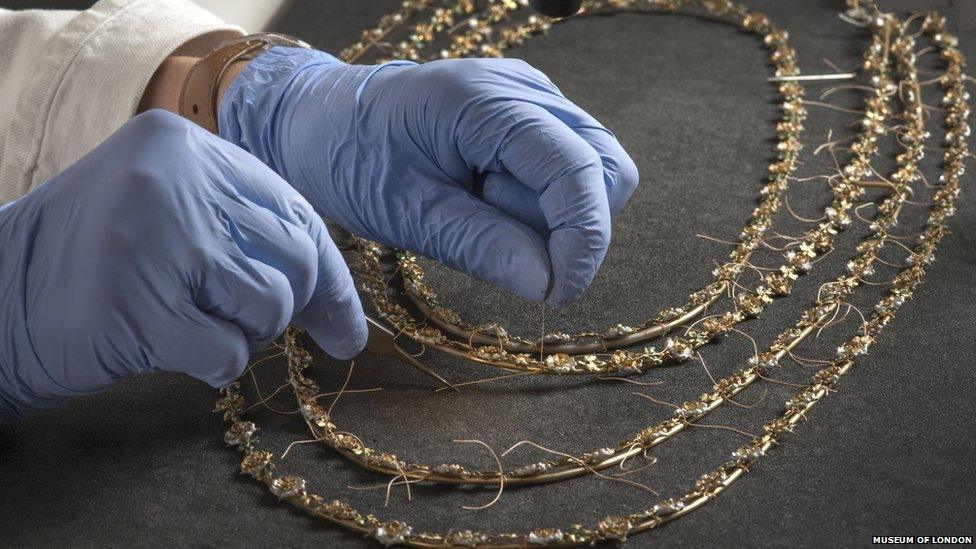Preparing necklaces for the exhibition