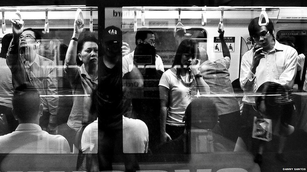 Rush hour on Singapore's underground subway.