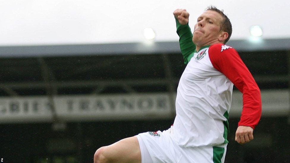 Bellamy celebrates after scoring one of two goals in a friendly draw against New Zealand at Wrexham