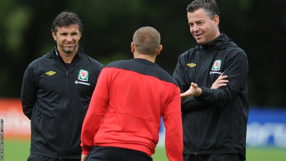 Manager Gary Speed (left) and assistant manager Raymond Verheijen chat with Bellamy during a Wales training session