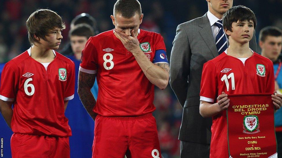 Bellamy is deeply affected by the death of Speed in November 2011. He lines up with Gary's sons Ed and Tommy prior to the memorial match against Costa Rica in February 2012