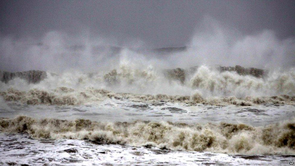 High tide waves approach the Bay of Bengal coast near Gopalpur beach in Ganjam district on 12 October