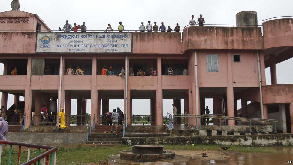 Villagers take refuge in a cyclone shelter at Gokhorkuda village in, Ganjam district