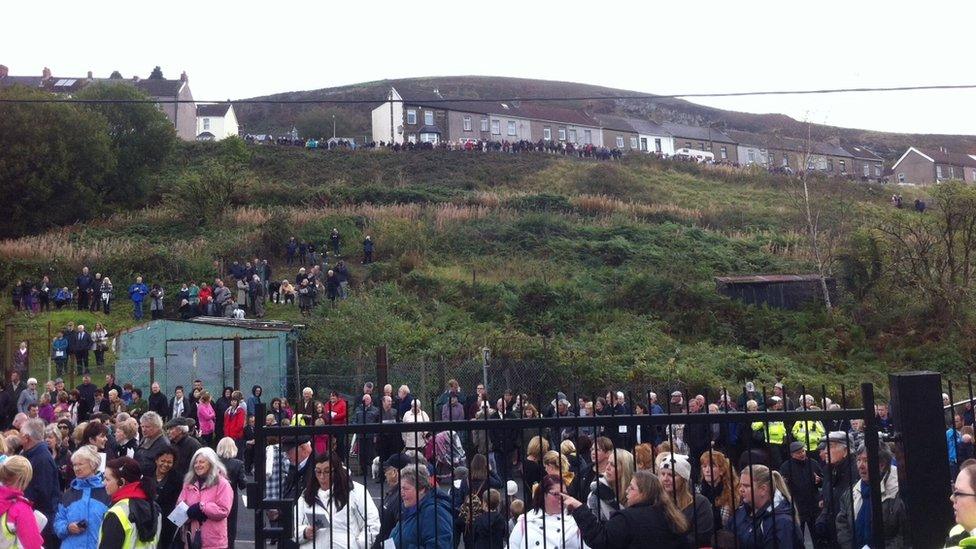 Hundreds of local people turn out in the streets of the Caerphilly county village to watch the events take place on Monday