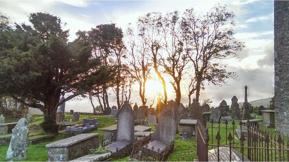 This graveyard view westwards at sunset was taken by the Reverend Roger Pitman from Llangeinor, near Bridgend