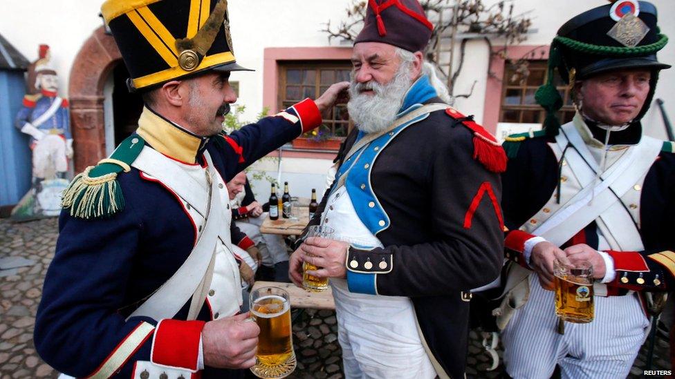 Battle of Leipzig re-enactors drink beer at a bivouac camp (19 October)