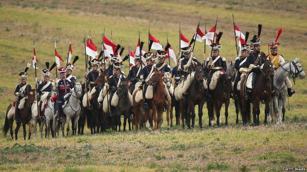 Participants playing the part of Polish Lancers arrive at the re-enactment of the Battle of Leipzig (20 October)