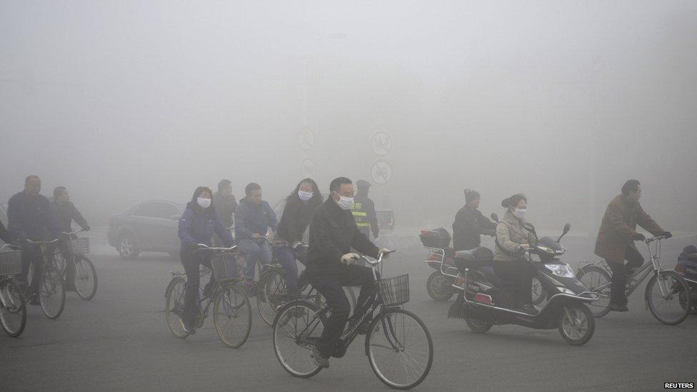 Cyclists in the smog