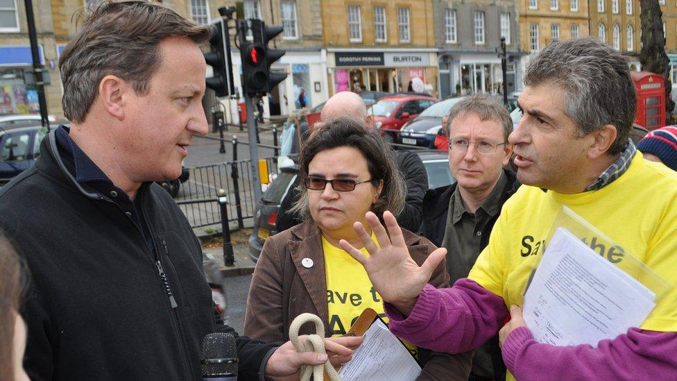 David Cameron in Chipping Norton being confronted by ACE Centre protesters