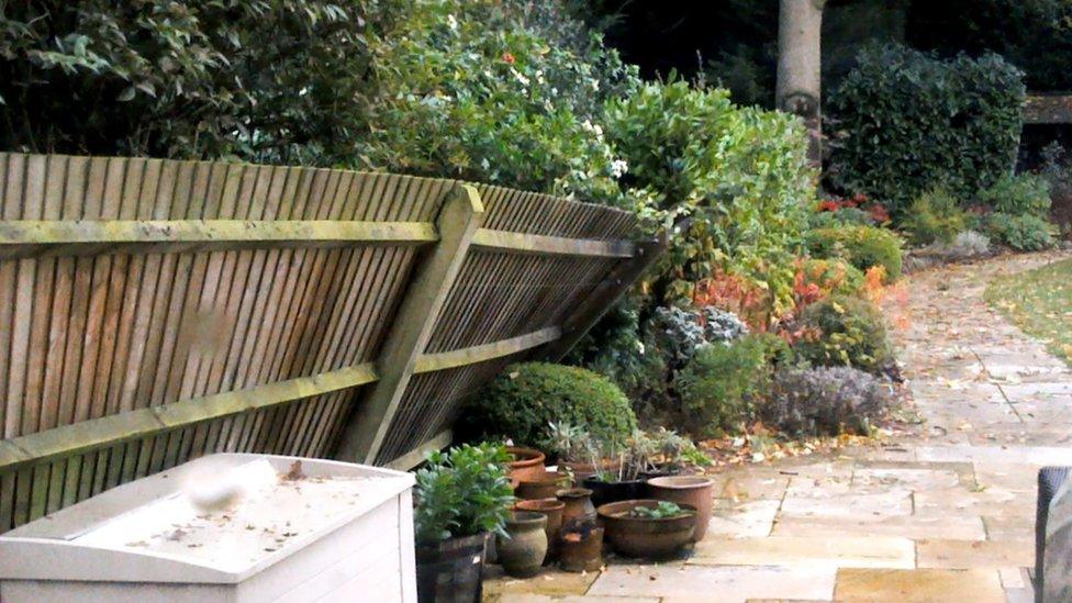 A fence that has blown over.