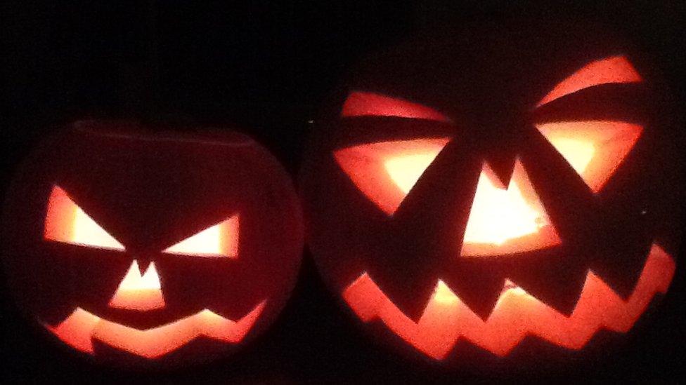 Two scary-looking carved pumpkins