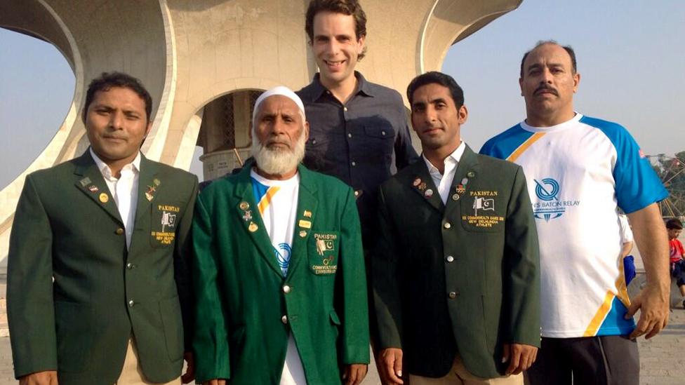 Abdul Ghafoor (centre left), Pakistan's first Commonwealth weightlifting medallist (in Edinburgh 1970) with his two sons, BBC Queen's Baton Relay presenter Mark Beaumont and Glasgow 2014 baton bearer.