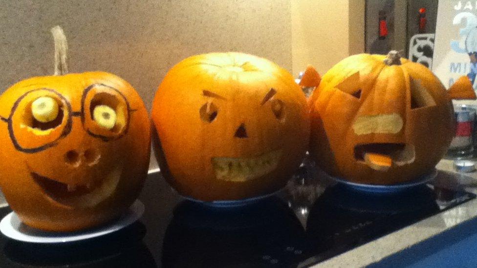 Carved pumpkins in a row