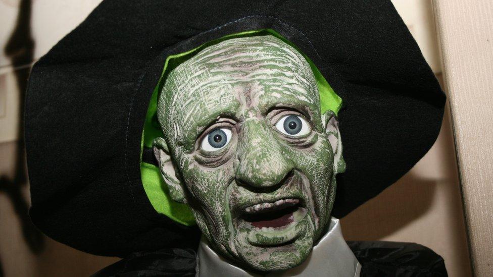 A green ghoul in a hat