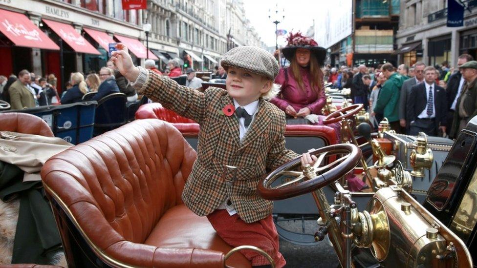 Henry Howe Davies, 5, sits on a 1902 Dion Bouton