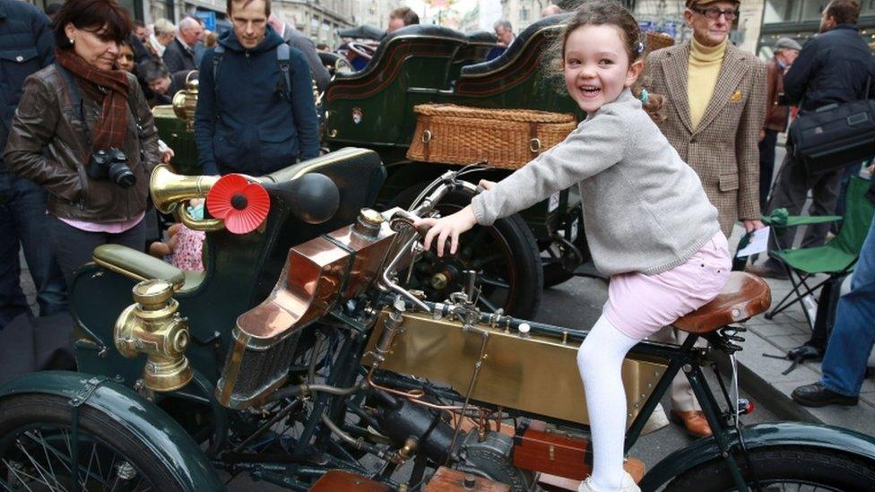 Youngster Aline Smale from Hampstead sits on a 1904 Humber Olympia Tandem