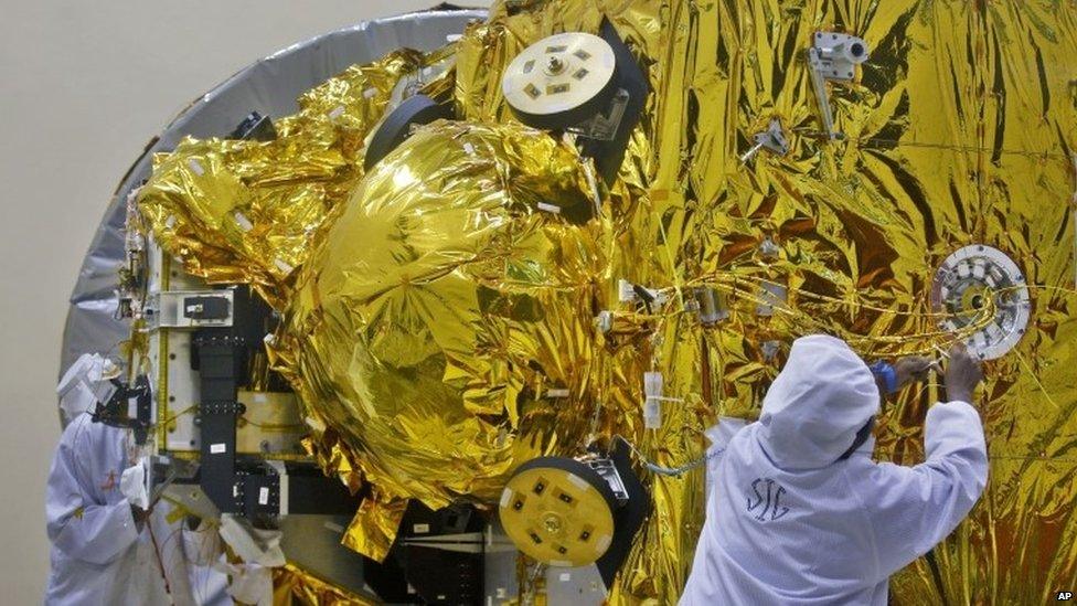 Indian engineers work on the Mars orbiter spacecraft at the satellite centre of Indian Space Research Organization (ISRO) in Bangalore, India