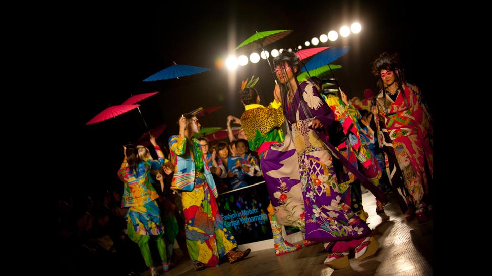 Models hold parasols during Fashion in Motion: Kansai Yamamoto at the V&A, London, 1 November 2013.