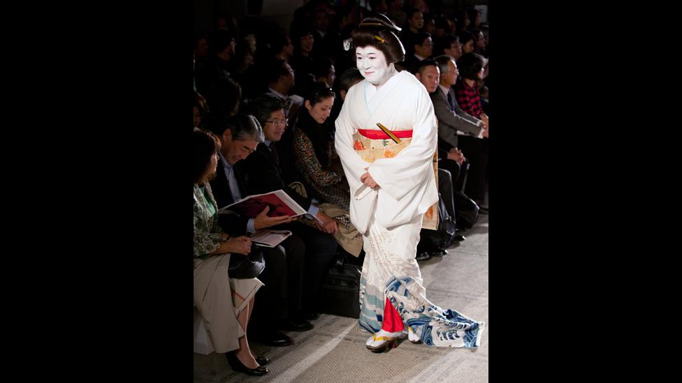 An audience member takes their seat for Fashion in Motion: Kansai Yamamoto at the V&A, London, 1 November 2013.