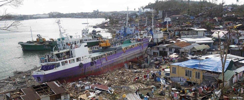 From ground level - Cargo ships washed ashore are seen four days after super typhoon Haiyan hit Anibong town, Tacloban city