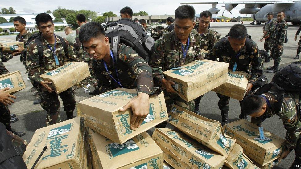 Personnel of the Philippines Army 51st engineer corps load water for victims of Typhoon Haiyan at Villamor Air Force Base in Manila, Philippines, on 11 November 2013