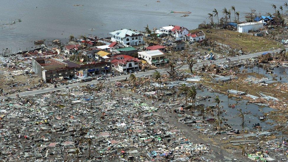 This aerial photo shows destroyed houses in the city of Tacloban, Leyte province, in the central Philippines on 11 November 2013