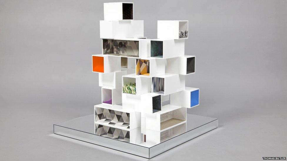 A house made up of stacked white boxes