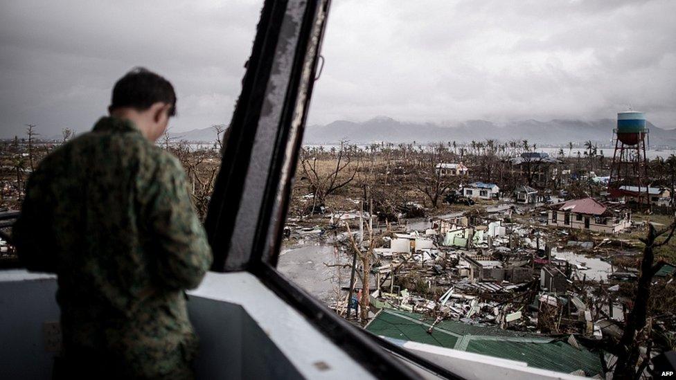 A Filipino soldier stands in the damaged control tower of the airport in Tacloban, on the eastern island of Leyte