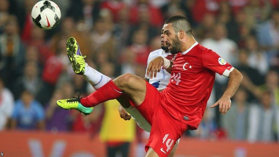 Turkey's Arda Turan, right, and Jeremain Lens of Netherlands