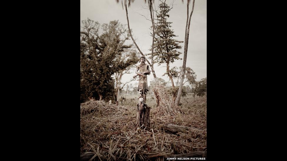 A Mursi tribesman holding a rifle