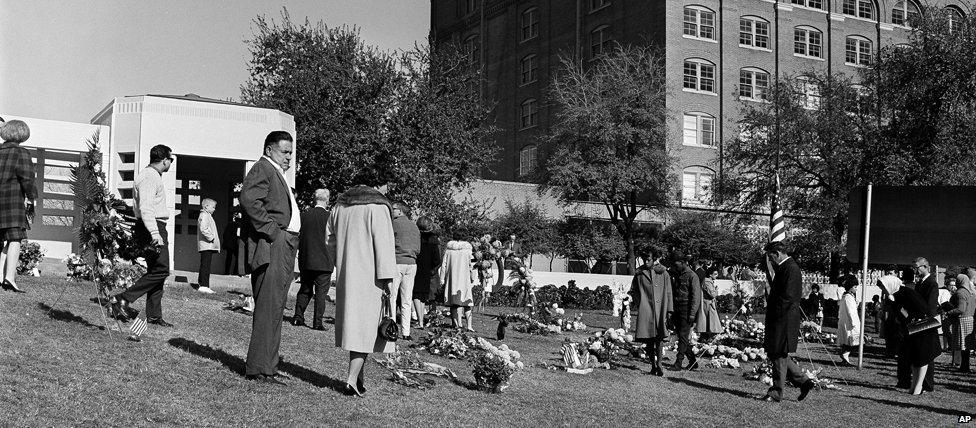 Crowds mourn outside the book depository