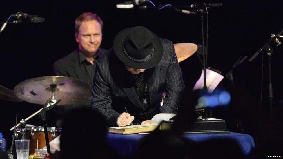 Van Morrison signs scroll