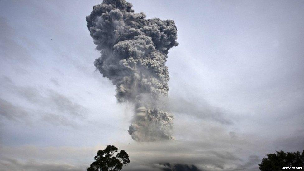 Mount Sinabung spews pyroclastic smoke as seen from Tigapancur village in Karo district on 14 November 2013 in Medan, Sumatra, Indonesia