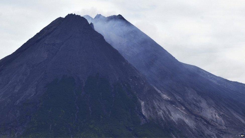 Mount Merapi spews volcanic material as it erupts as seen from Pakem, near the ancient city of Yogyakarta, Indonesia, early 18 November 2013