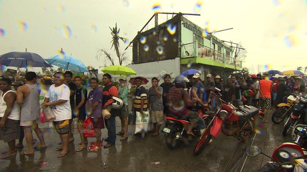 People queuing up at petrol stations in Tacloban, a city devastated by Typhoon Haiyan, in Leyte, central Philippines