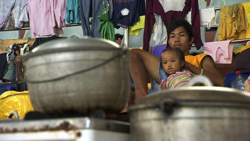 Residents of Tacloban, a city devastated by Typhoon Haiyan, in Leyte, central Philippines