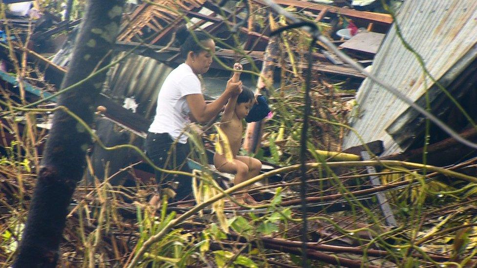 Survivors in Pawing, devastated by Typhoon Haiyan, in Leyte, central Philippines