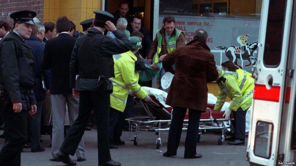 Paramedics treat victims of the shooting