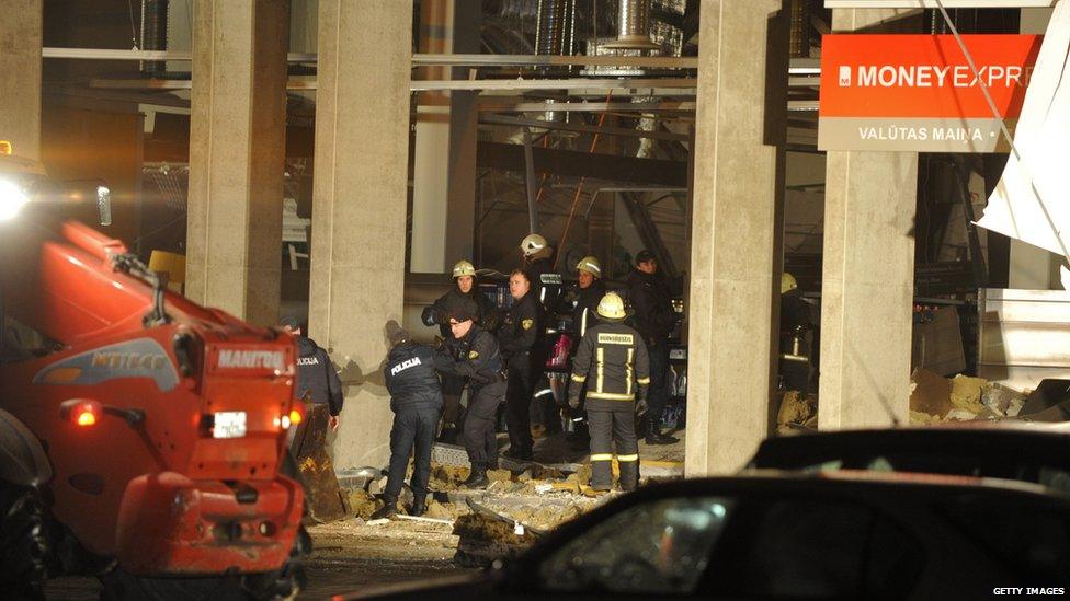 Rescuers search for survivors under the rubble at the Maxima supermarket, after a roof collapsed in Riga