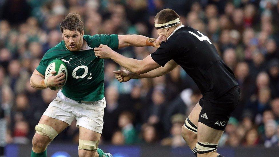 Sean O'Brien fends off a tackle from Luke Romano during New Zealand's win over Ireland in Dublin