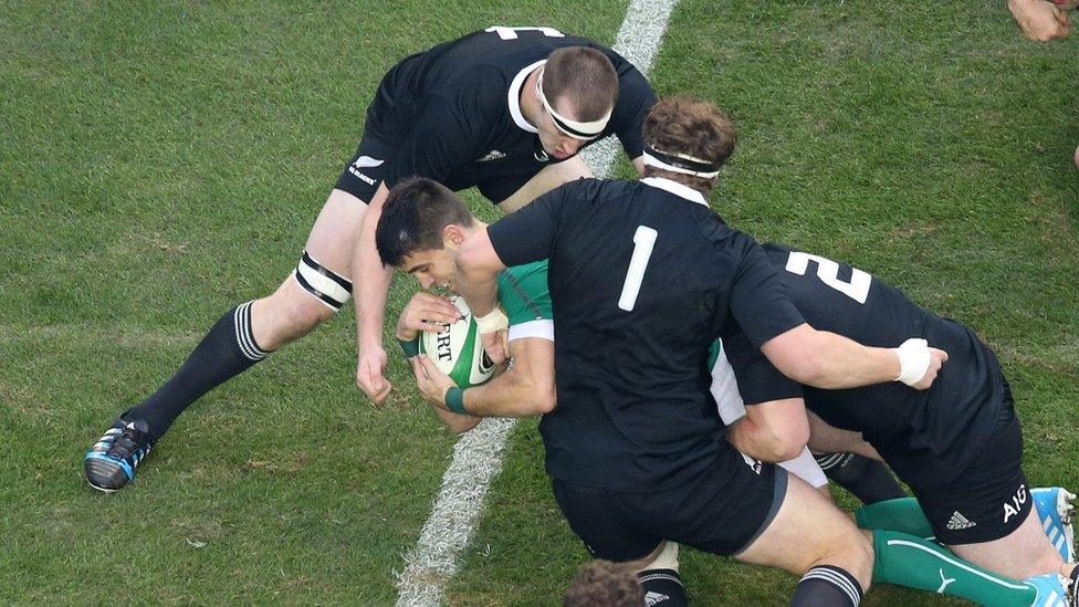 Scrum-half Conor Murray dives over the line for the first of Ireland's three first-half tries