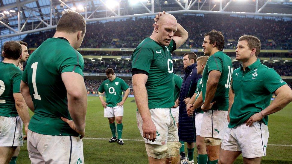 Ireland players, including skipper Paul O'Connell and Brian O'Driscoll, show their dejection after a last-gasp defeat by New Zealand