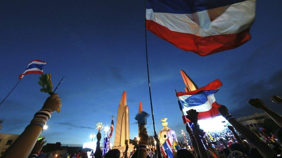 Thai national flags fly at Democracy Monument during an anti-government rally, calling for Thai Prime Minister Yingluck Shinawatra to step down, in Bangkok, Thailand, 24 November 2013