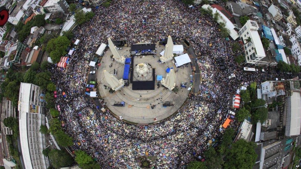 In this photo released by Siam 360, anti-government protesters stage a rally, calling for Thai Prime Minister Yingluck Shinawatra to step down, at Democracy Monument in Bangkok, Thailand, 24 November 2013