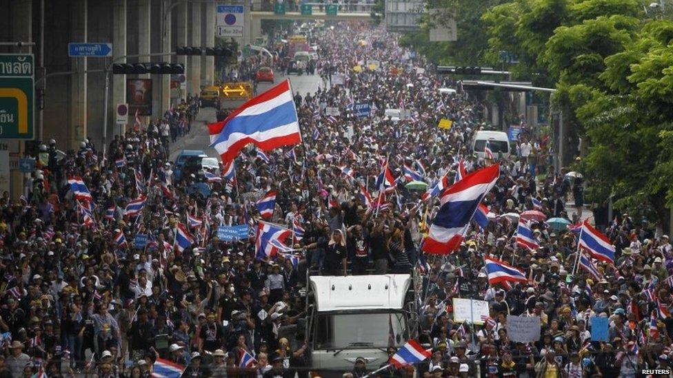 Anti-government protesters march toward Thailand's Finance Ministry in Bangkok, 25 November 2013