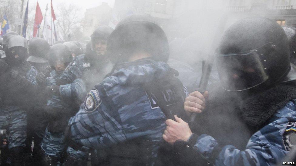 Police react to pepper spray in Kiev, Ukraine, 25 Nov