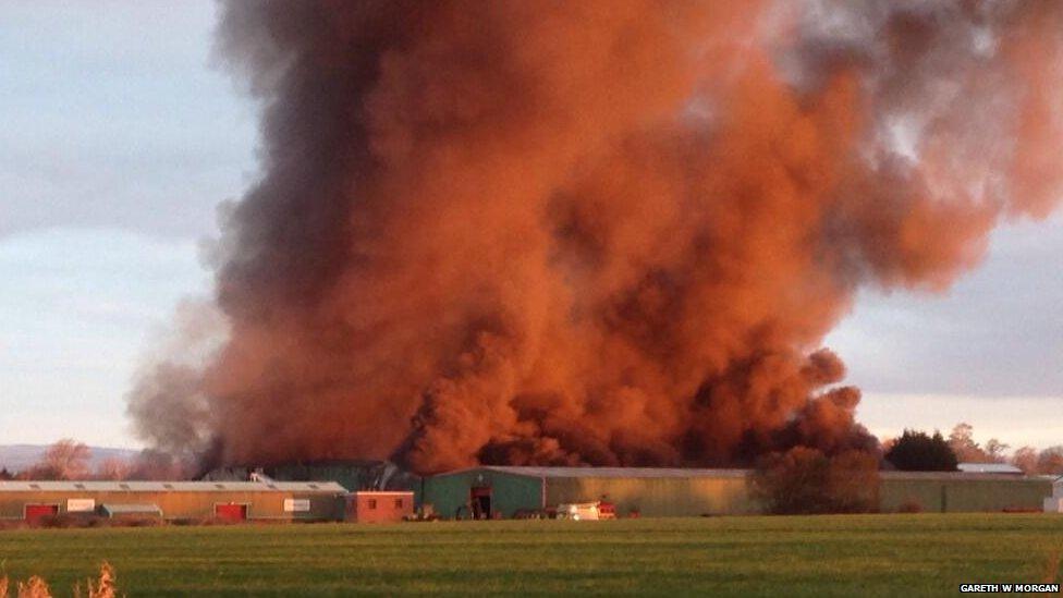 About 60 firefighters are tackling a large blaze at an industrial estate in the Vale of Glamorgan.