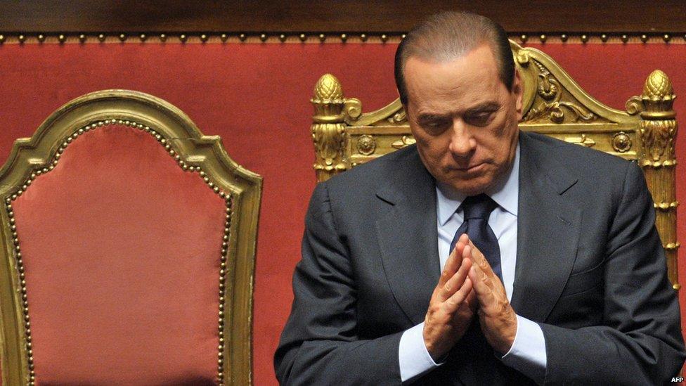 This file picture taken on December 13, 2010 in Rome shows Italian Prime Minister Silvio Berlusconi reacting after he delivered an address to the Senate.