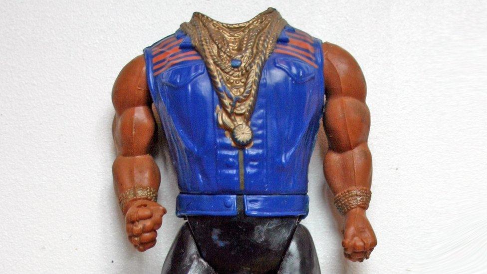 Mr T action figure missing its head.